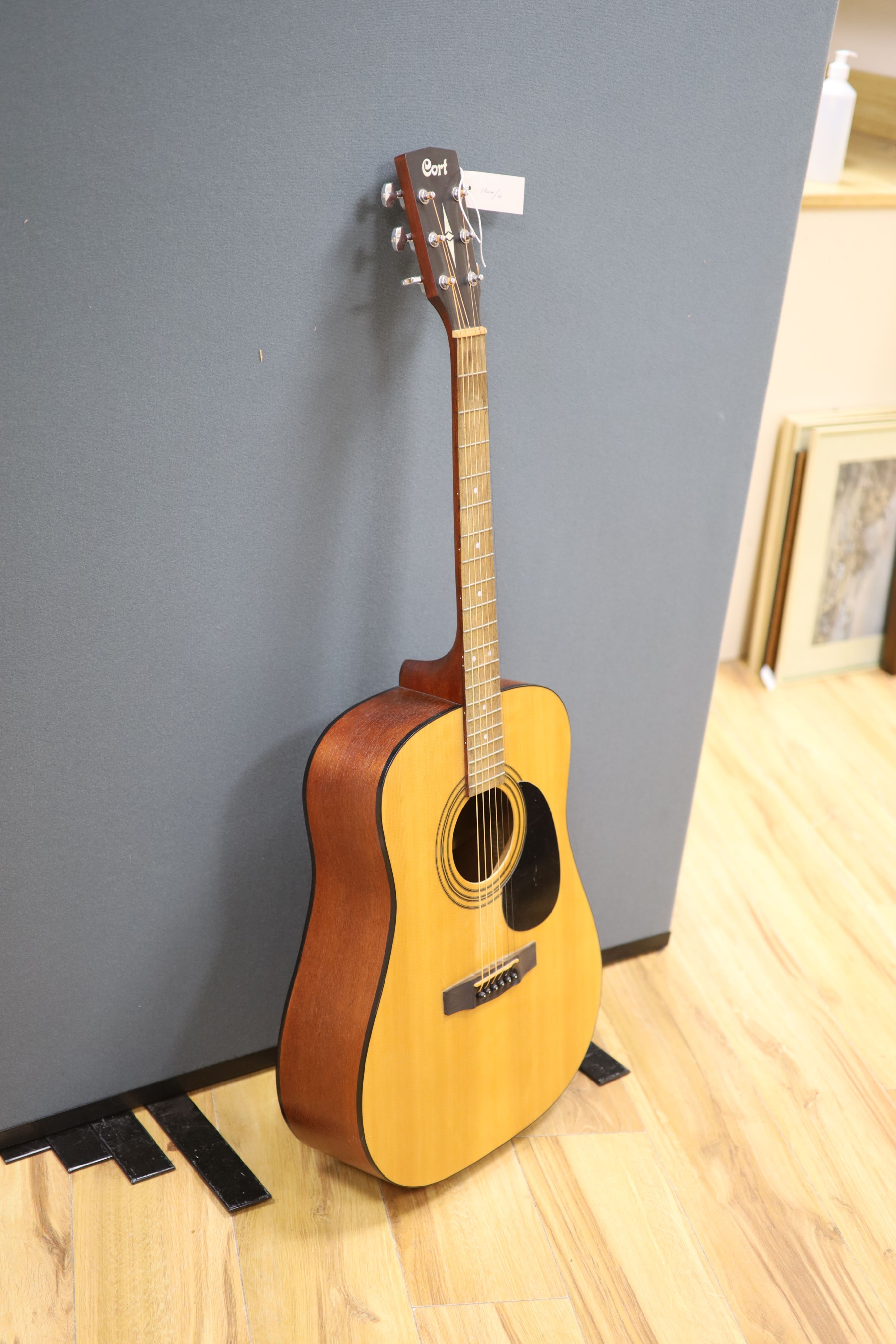 A Cort acoustic guitar